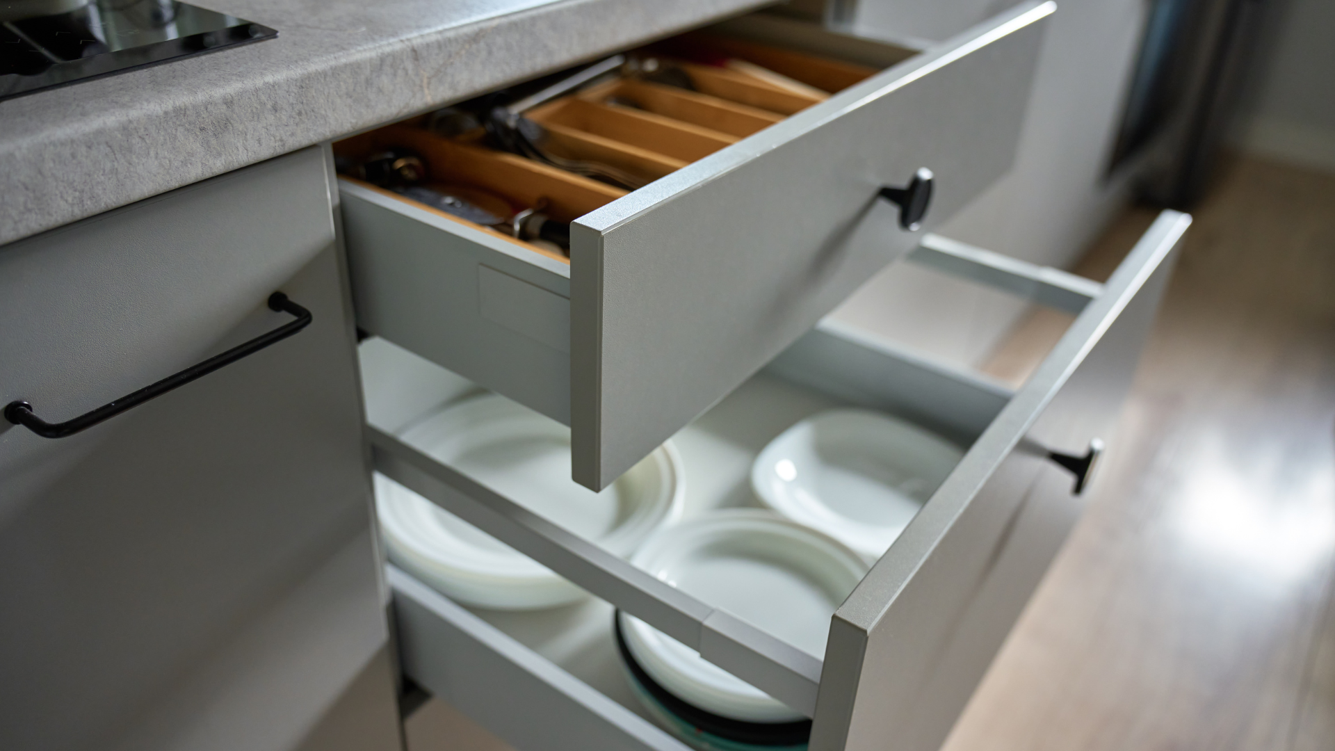 Space-planned kitchen drawers with cutlery organiser and zoned white ceramic plates